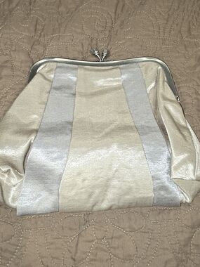 Bath & Body Works Metallic Cream and Silver Stripe Kiss-Lock Clutch
